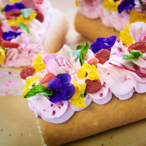 roulade with cream and flowers on top